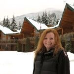 Simone Mattner smiles in front of Yellow Cedar Lodge. She is excited bout the lodge renovations.