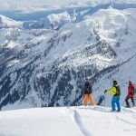 Heli Ski group enjoying the mountain view. 